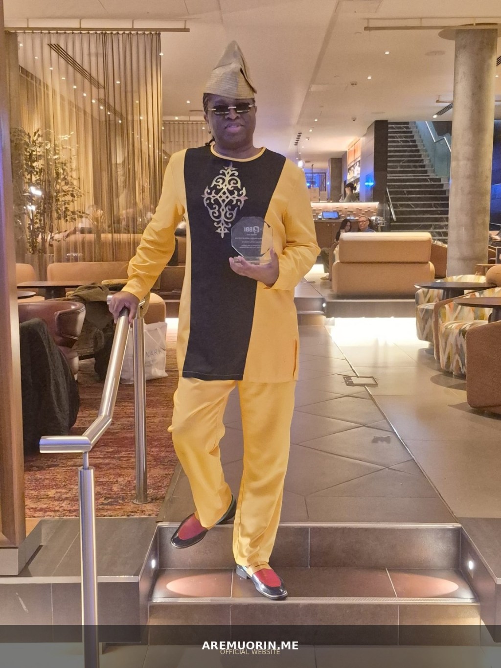 Aremuorin holding the BBI Awards 2026 Performing and Creative Artist of the Year award at Hilton London Tower Bridge.